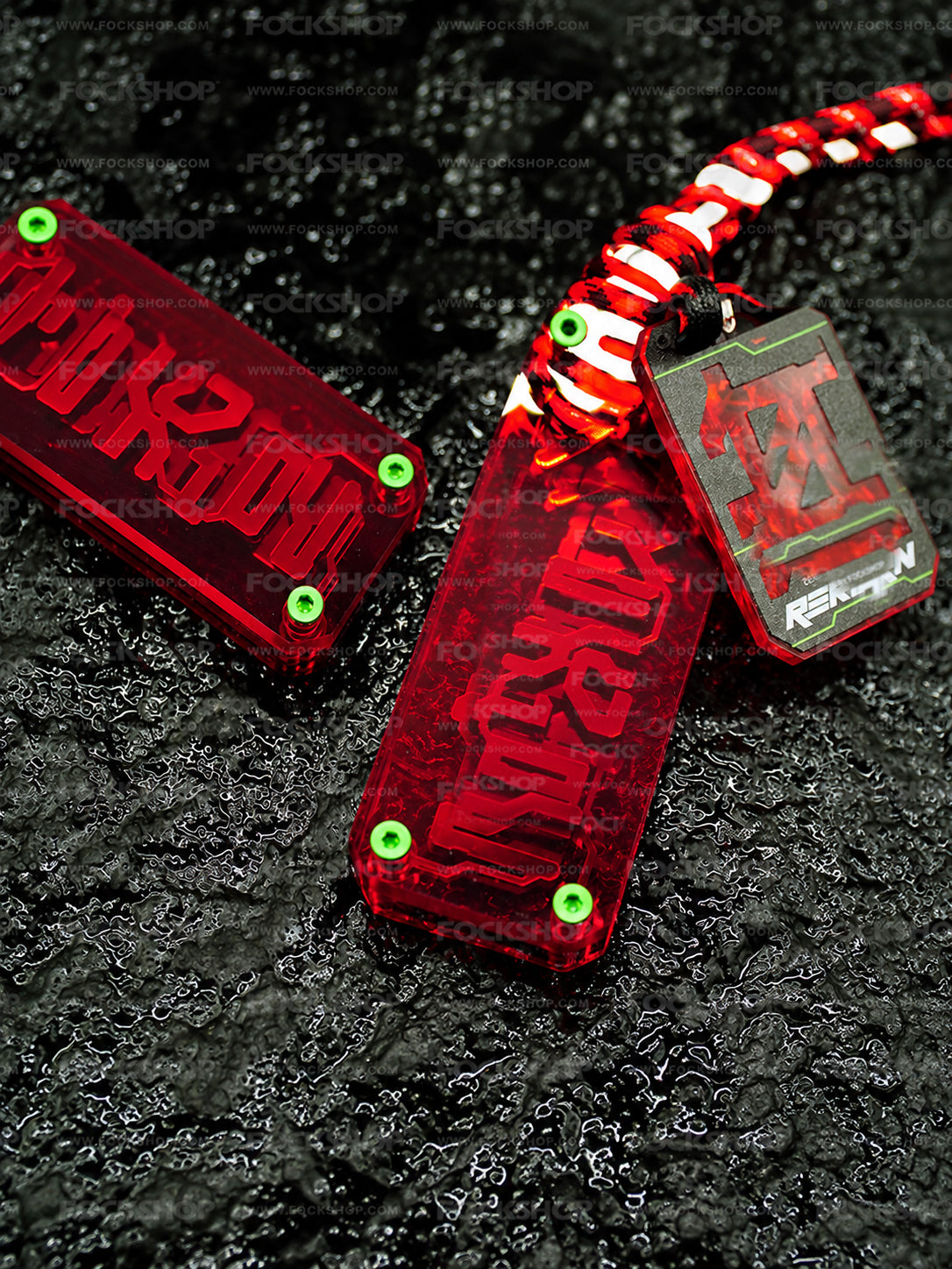 FOCKSHOP REBORN talisman charm — red charms with engraved talisman details on textured black ground