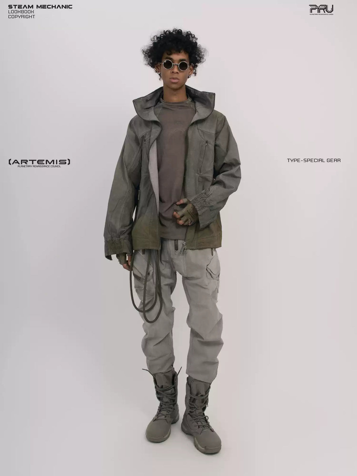 ARTEMIS tuck-paneled technical jacket in lunar soil green — full-length modeled front view with the jacket open