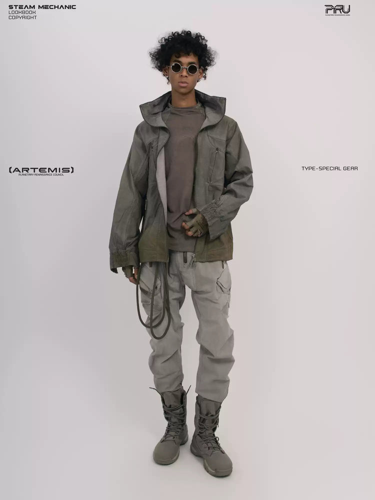 ARTEMIS tuck-paneled technical jacket in lunar soil green — full-length modeled front view with the jacket open