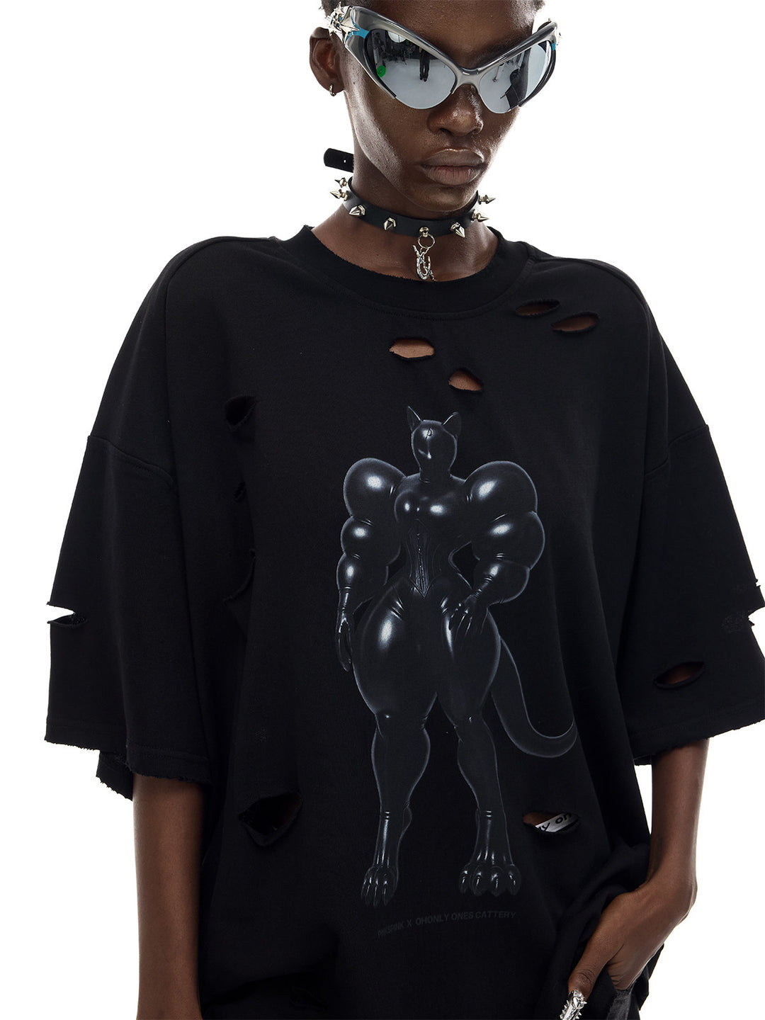 PINKSPINK FUTURE CAT distressed oversized tee in black — front modeled close-up showing the cat graphic and distressed neckline