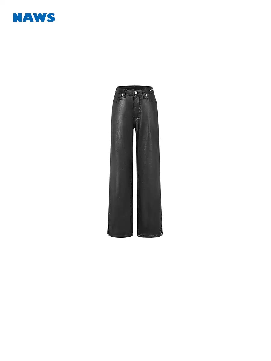 NAWS wax-coated zip-hem jeans in BATIK BLACK — front garment-only view showing the button waist fastening and straight legs.