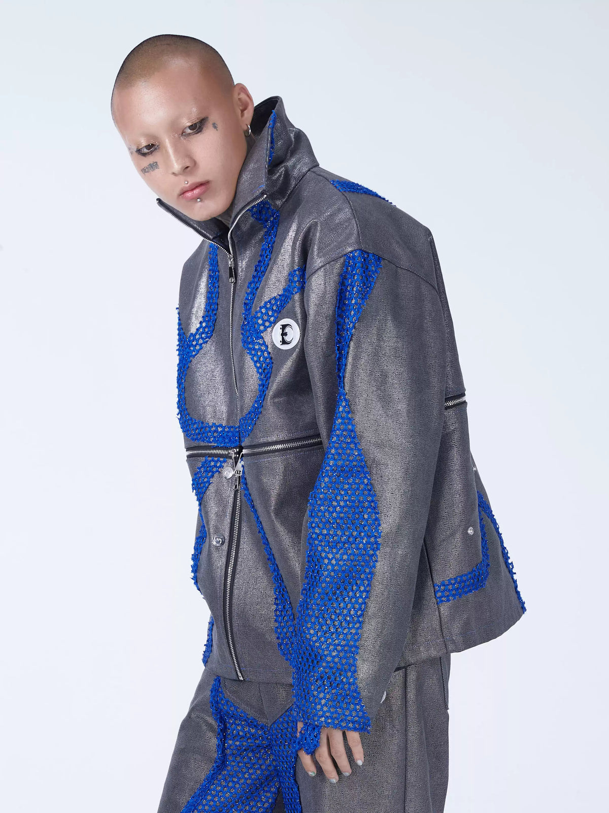 EMBRYO METAL SHELL convertible canvas jacket — angled modeled view