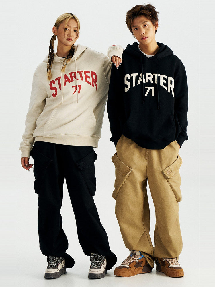 STARTER ZOO Zebra Gray sneakers on the woman at left in a full-body styled look; brown sneakers on the other model are a separate design