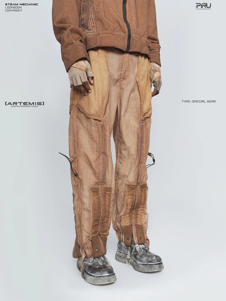 STARCORE venus orange engineer utility pants — three-quarter front modeled view facing left
