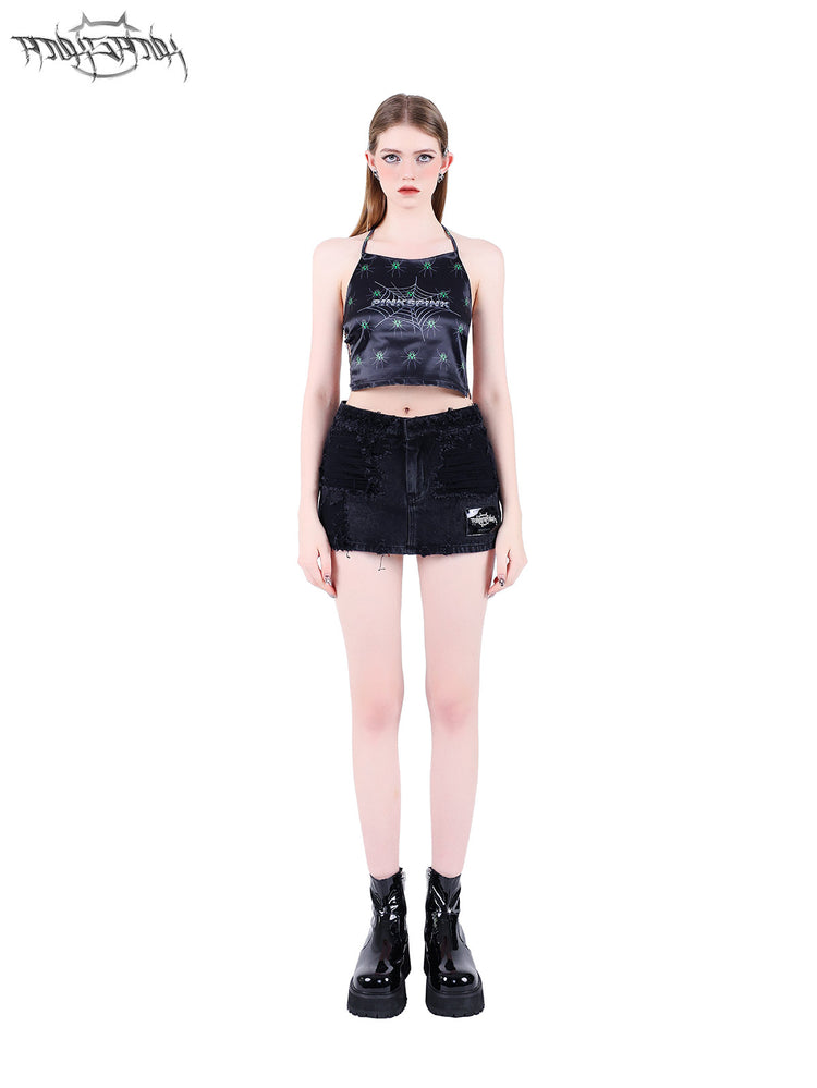 PINKSPINK SPIDER web-mesh halter crop top — front full-length modeled view styled with a mini skirt and hands at sides