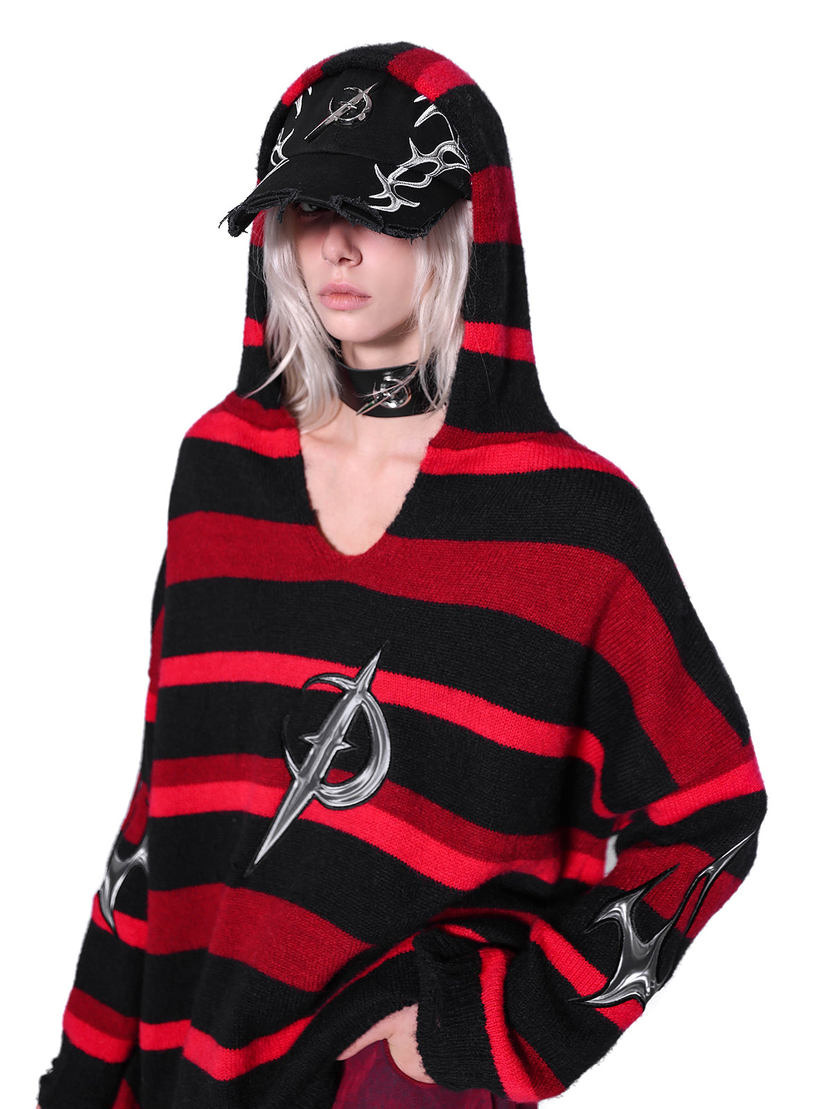 PINKSPINK ELECTRIC MOON striped hooded sweater in BLACK AND RED — close angled view showing dropped shoulder and V-neck.