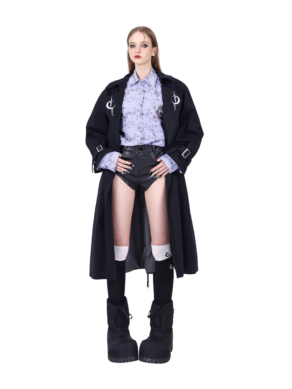 PINKSPINK ELECTRIC MOON reversible patchwork trench coat in black — open-front modeled view with hands on hips