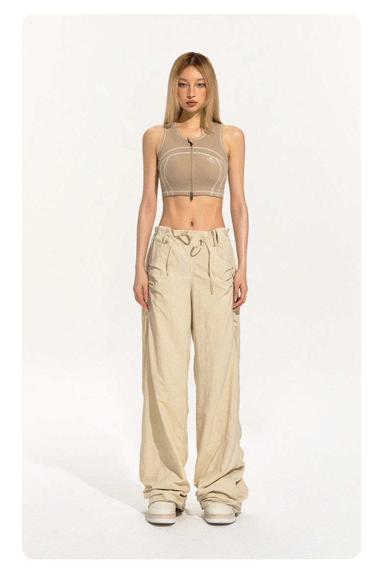 NAWS CLOUD zip-front sports bra — modeled detail view of the garment construction