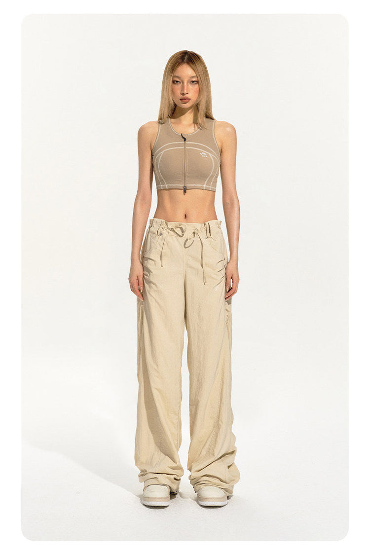 NAWS CLOUD zip-front sports bra — modeled detail view of the garment construction