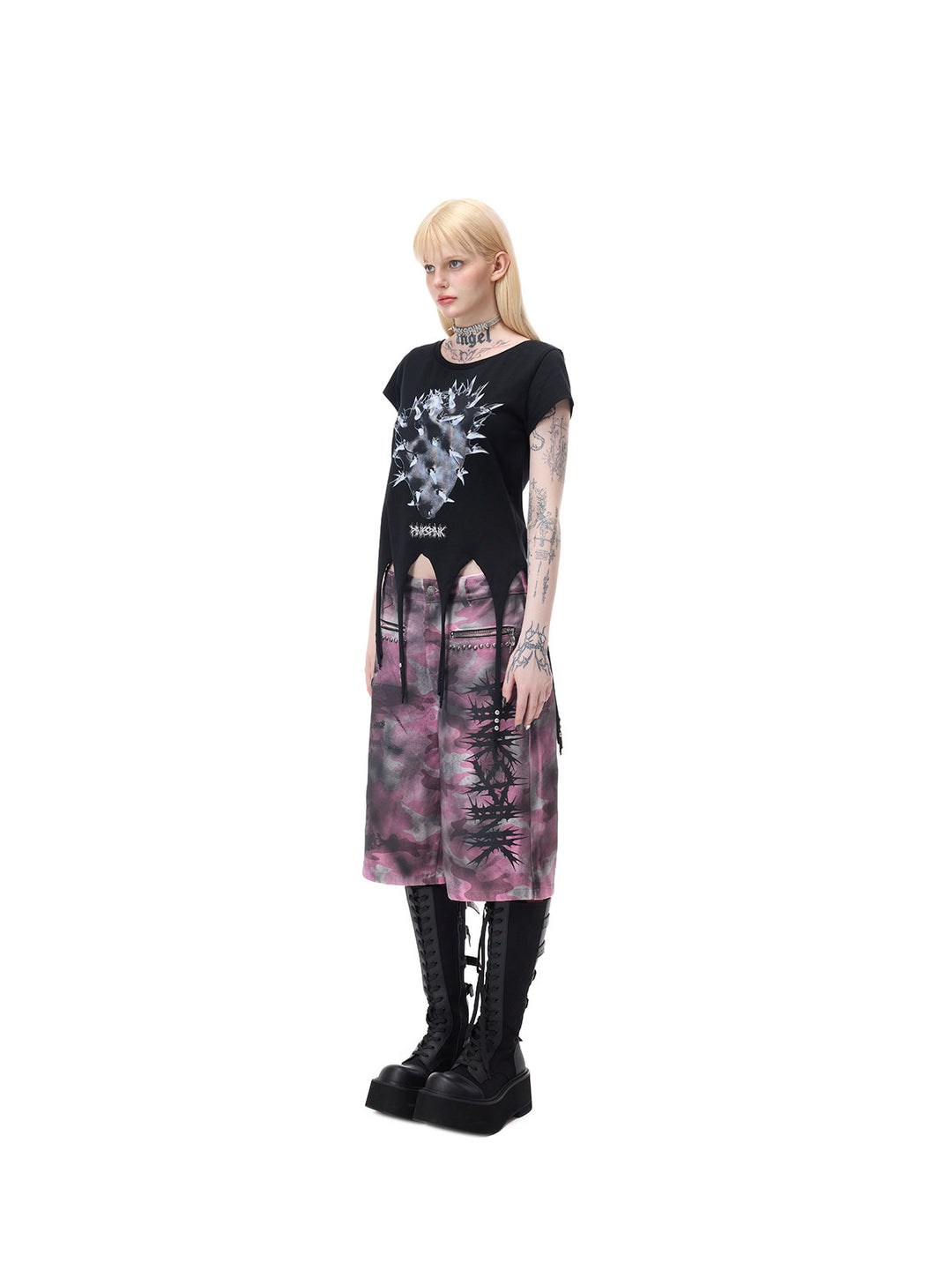 PINKSPINK PUNK CACTUS studded pointed-hem tee in black — full-length side modeled view showing the fitted body and extended hem points