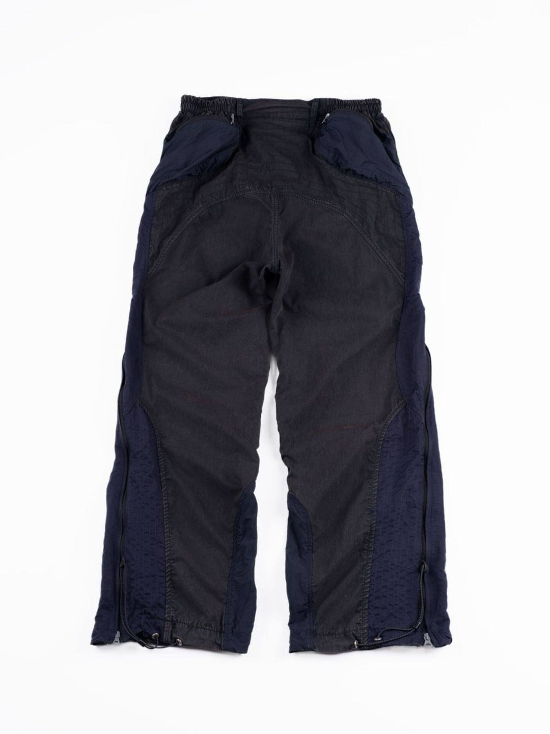 SUPERNOVA zima blue metallic nylon technical pants — zima blue back flat-lay showing the shaped rear pockets