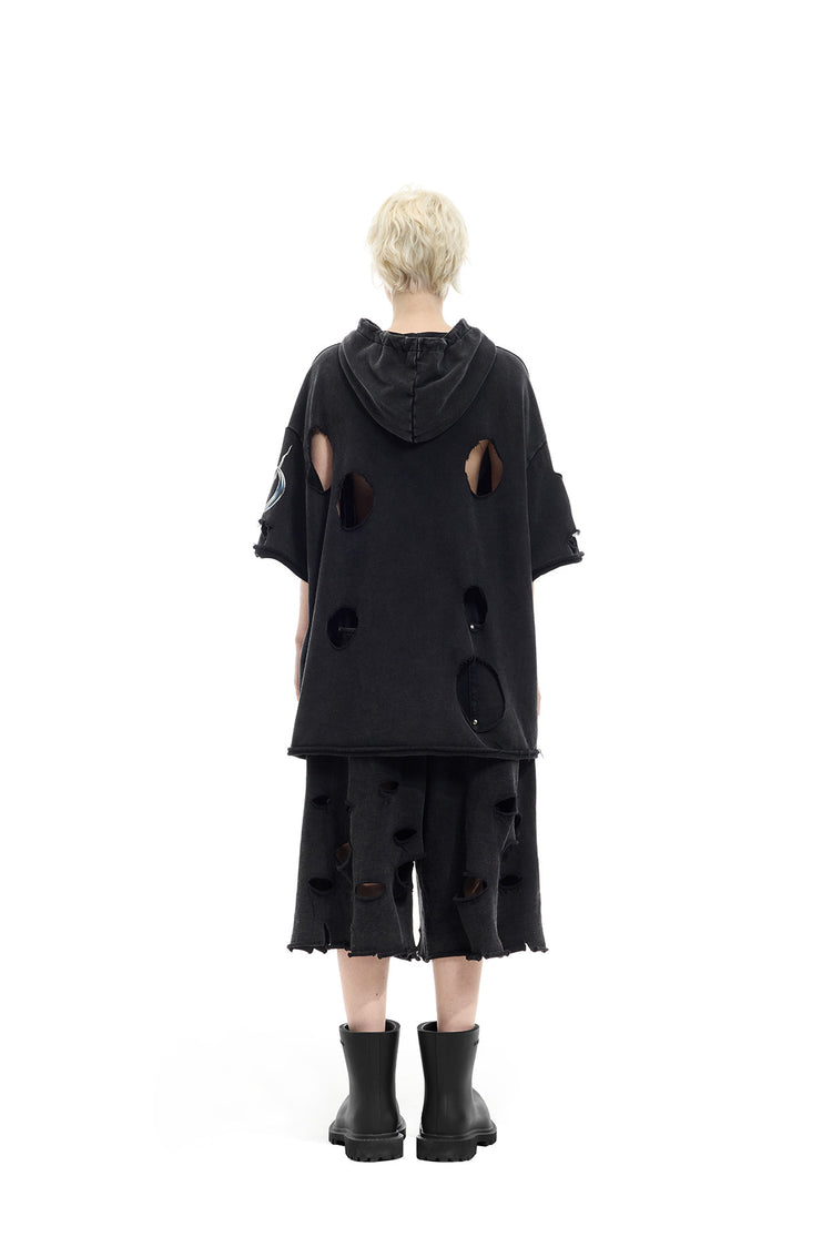 PINKSPINK ELECTRIC MOON distressed embroidered wide-leg shorts — black — full-length back view styled with boots