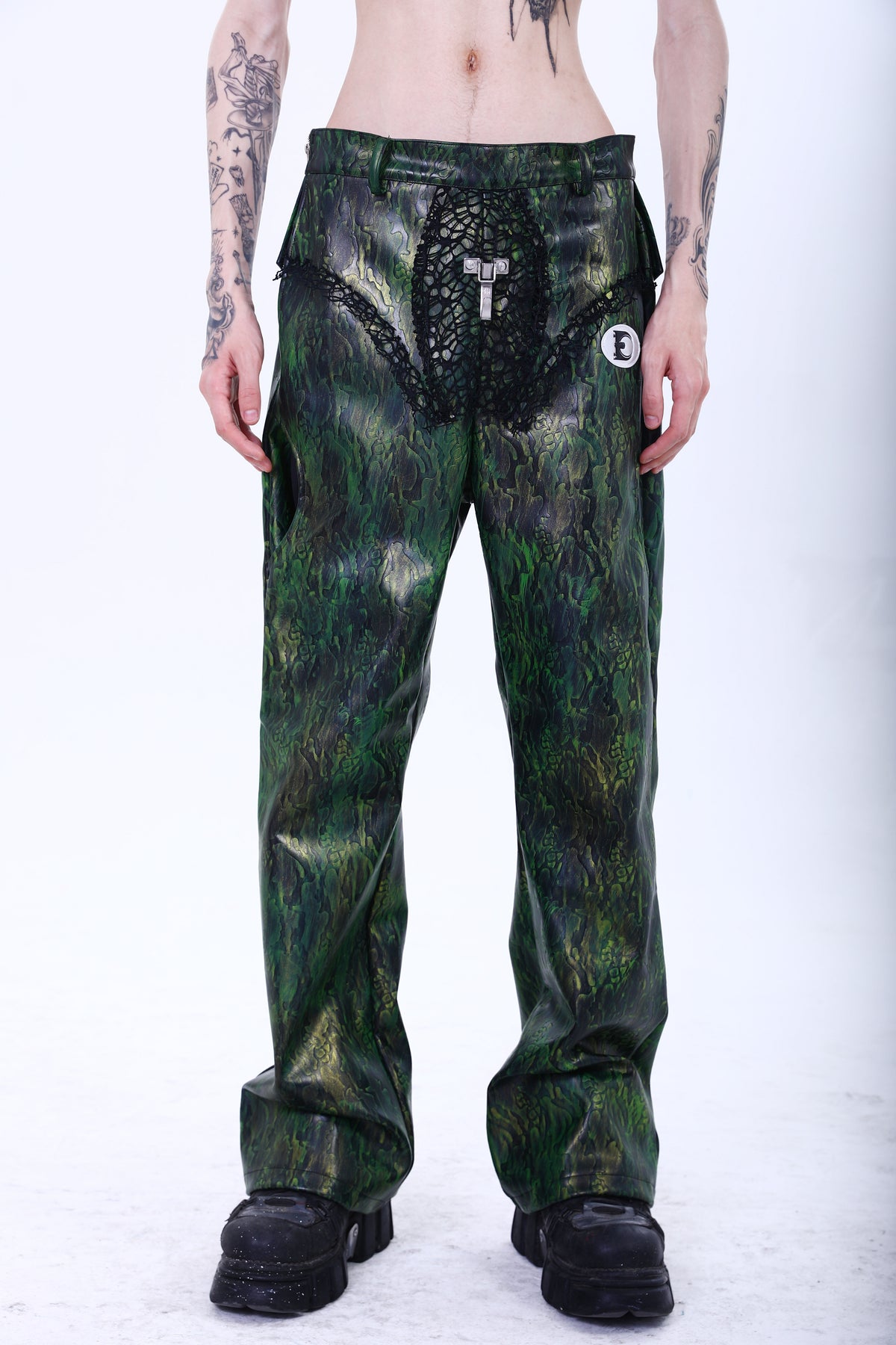 EMBRYO TRIANGLE ARMOR lace-inset leather pants — rear modeled view