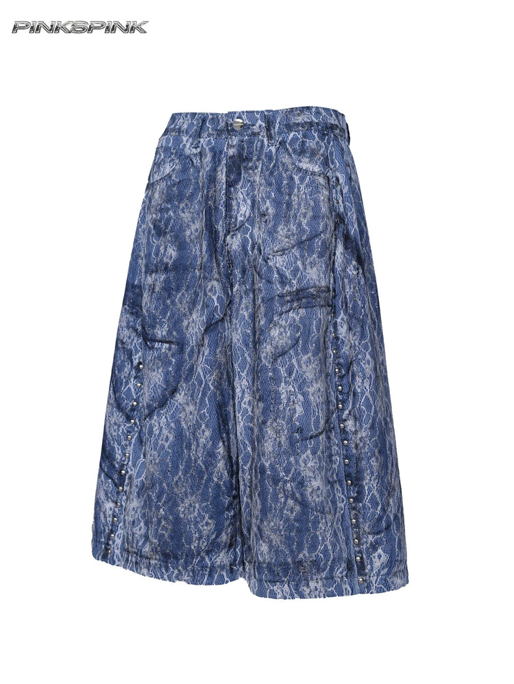 PINKSPINK ELECTRIC MOON lace-coated wide-leg denim shorts in blue — angled garment-only view showing the studded pockets