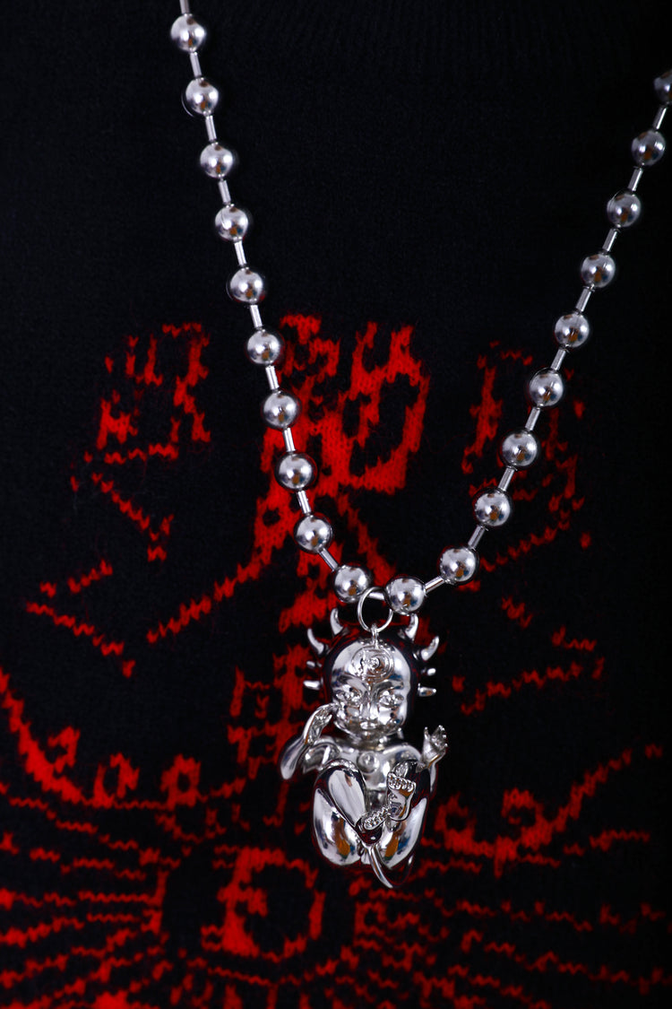 EMBRYO DEVIL CHILD sculptural pendant necklace — side or detail presentation