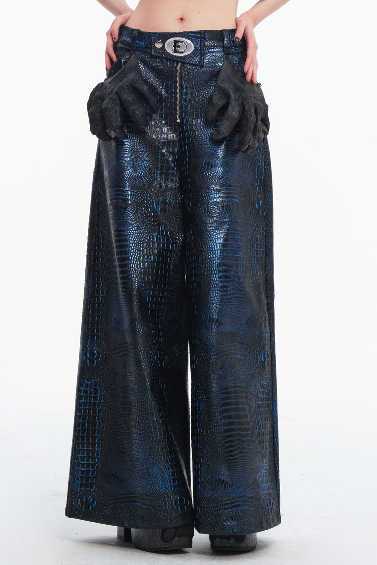 EMBRYO CLAW ARMOR crocodile-effect wide-leg pants — rear modeled view