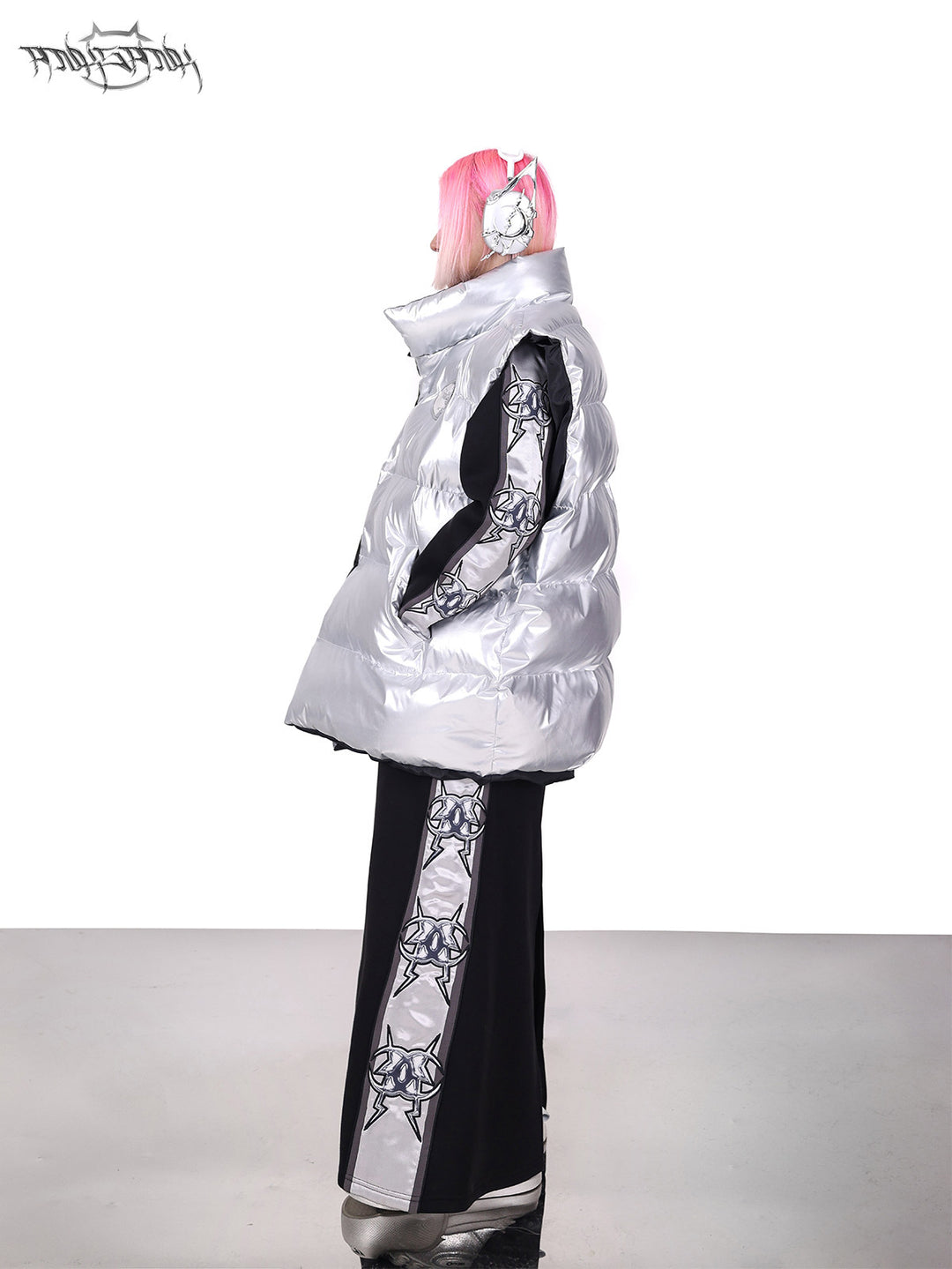 PINKSPINK ORBIT reversible padded vest in black silver — silver-side profile modeled view showing the high collar and padded shape