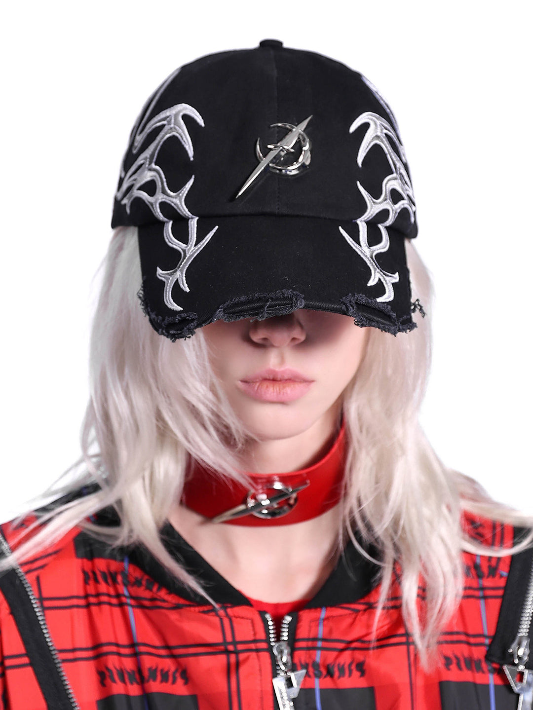 PINKSPINK ELECTRIC MOON black-red racing cap — modeled detail view of the garment construction