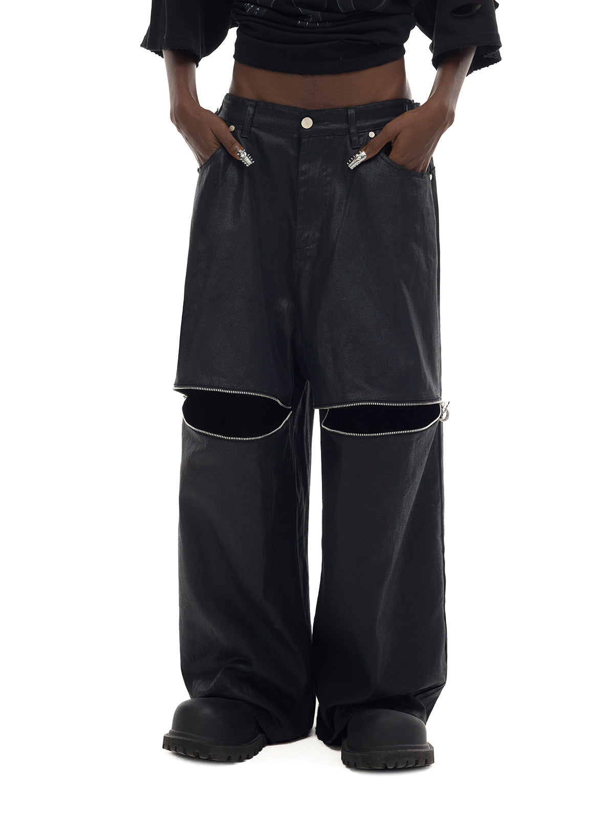 PINKSPINK ELECTRIC MOON coated zip-knee wide-leg pants in black — front waist-to-hem modeled view showing the open knee zippers