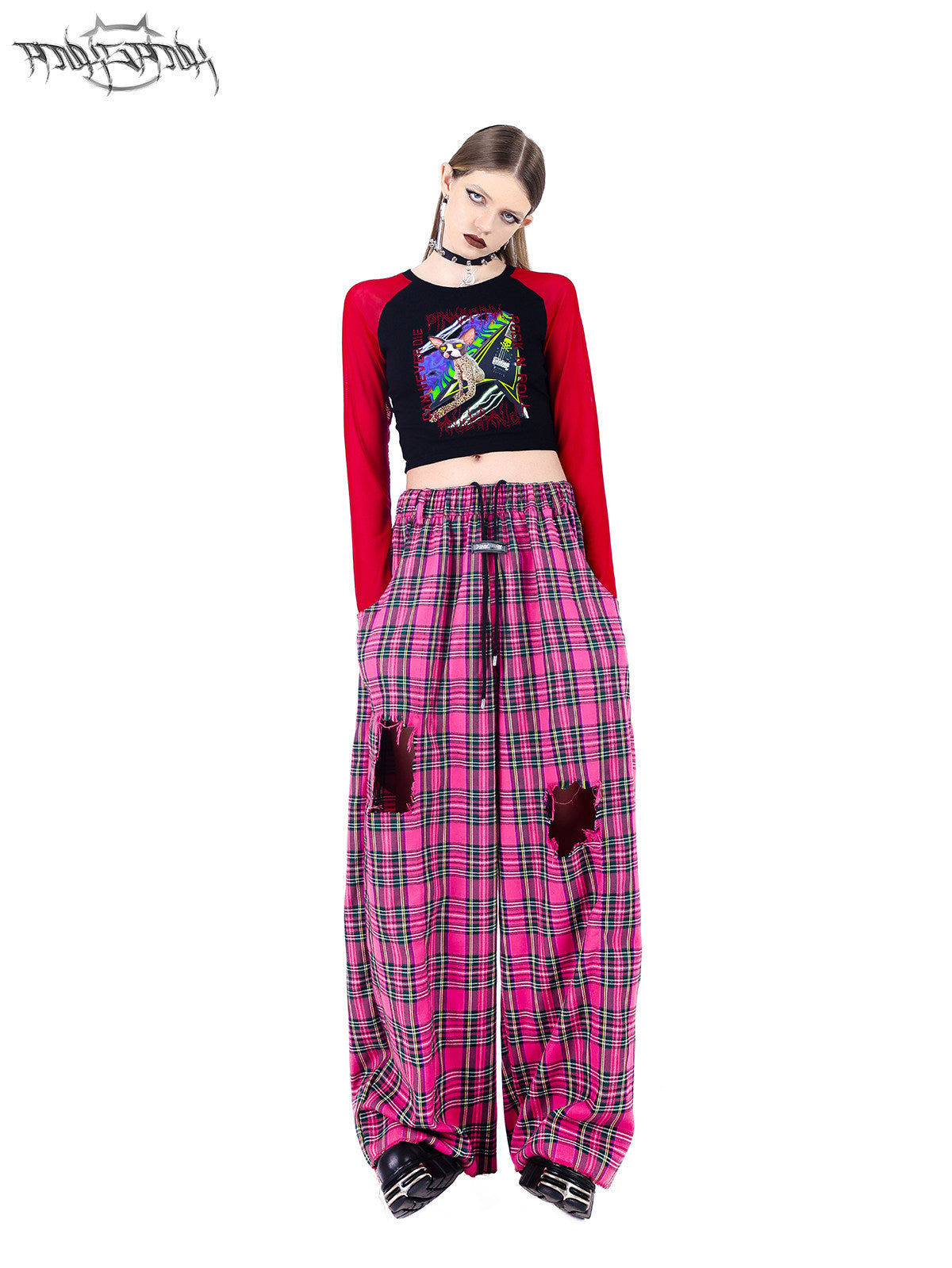 PINKSPINK PINK RIOT distressed plaid wide-leg pants — pink plaid full-length front view styled with a red raglan top