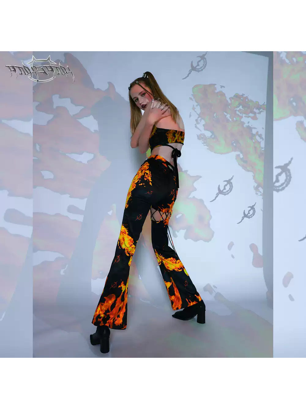 PINKSPINK ELECTRIC MOON cutout detachable flare pants — close modeled view highlighting the construction