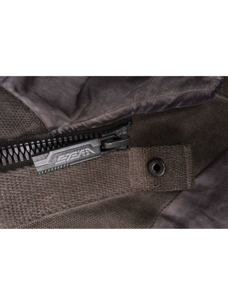 FISSION modular vest — close-up of the branded zipper pull and eyelet