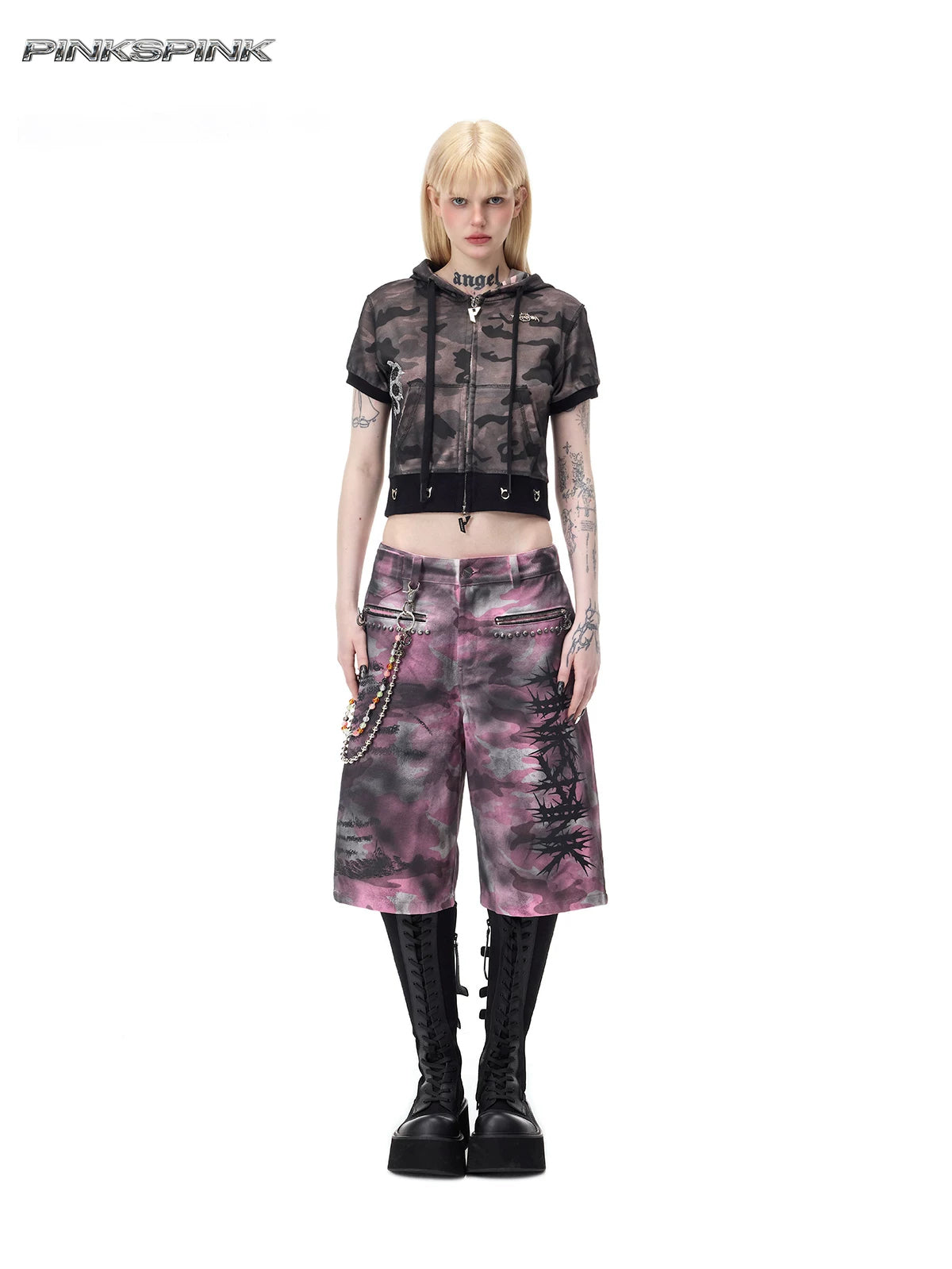 PINKSPINK ELECTRIC MOON coated camouflage denim shorts in pink-gray camouflage — full front modeled view with wide legs and studded zip pockets