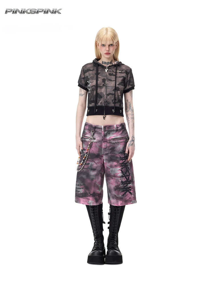 PINKSPINK ELECTRIC MOON coated camouflage denim shorts in pink-gray camouflage — full front modeled view with wide legs and studded zip pockets