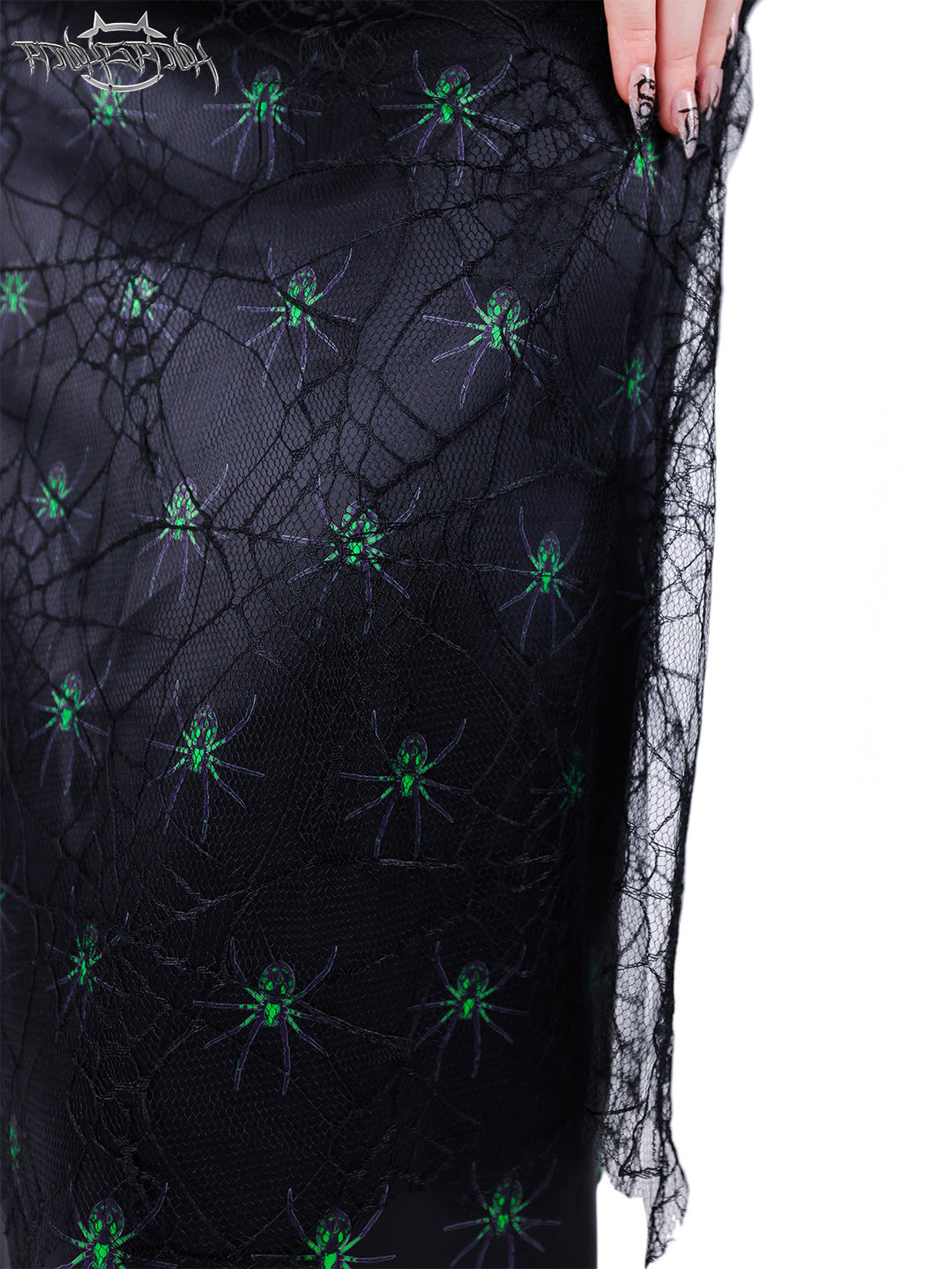 PINKSPINK SPIDER layered web-mesh midi skirt — close-up showing the web-mesh overlay and green spider print