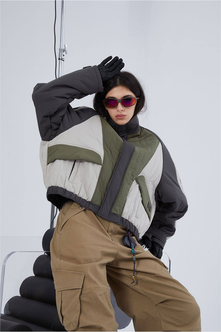 ERRORCODE ROBOT gray, white and green colorblock quilted cropped jacket, modeled view with one arm raised