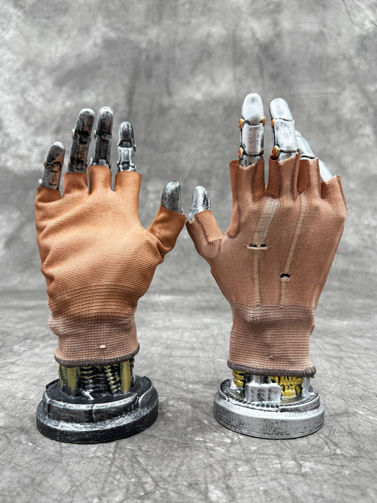 STEAM FUNCTION PRECISION CASTING distressed fingerless gloves in soft orange, PALM GLUE — coated palm and distressed back views on display hands
