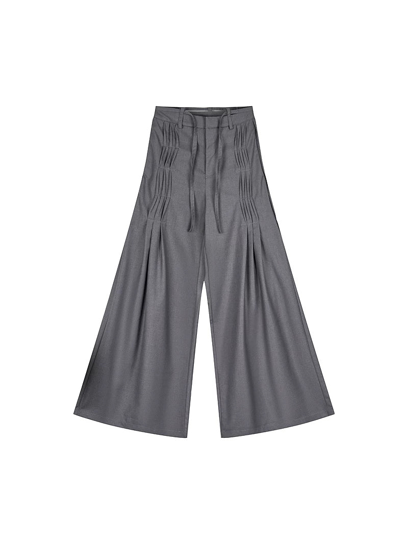 NEXT PASSPORT gray pleated wide-leg trousers photographed alone on white