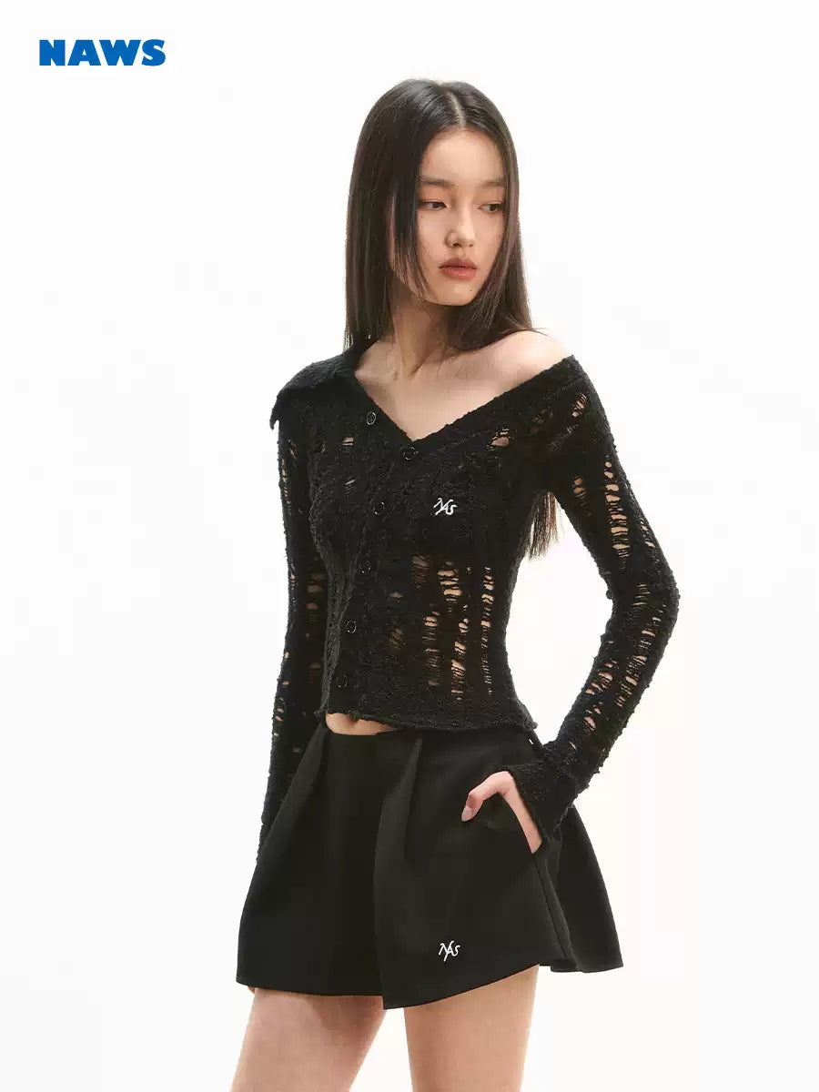 NAWS NOMAD asymmetric cutout knit cardigan — close modeled view highlighting the construction