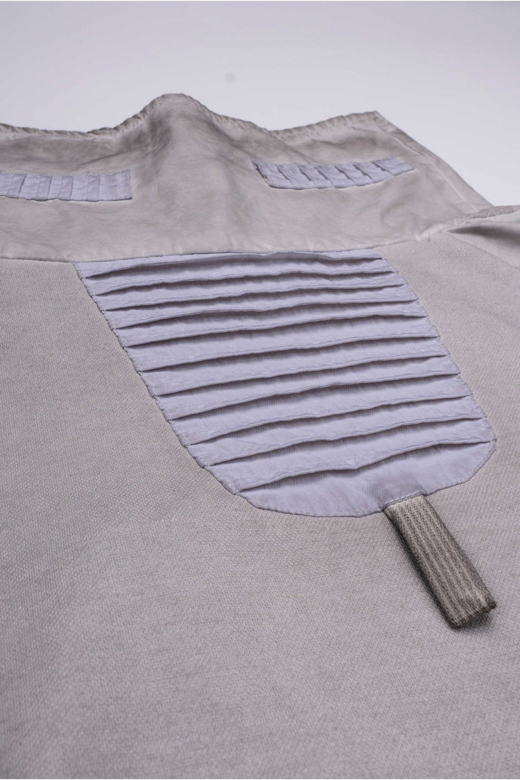 PIONEER eris white detachable-pocket utility hoodie — close-up of the pleated back panel and hanging loop