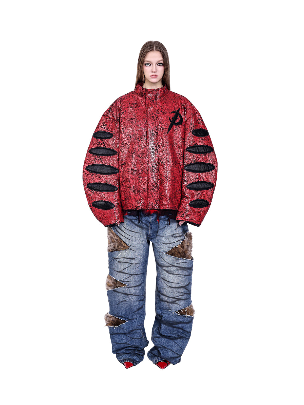 PINKSPINK ELECTRIC MOON cracked faux-leather moto jacket — Front view of the oversized red cracked jacket styled with blue jeans