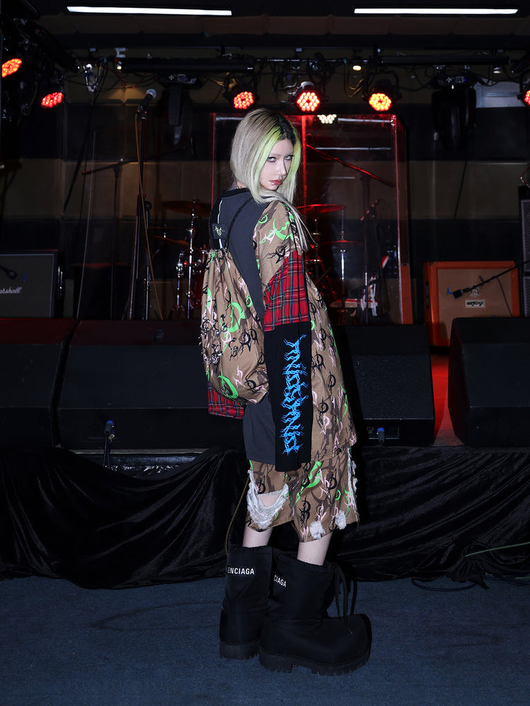 PINKSPINK ELECTRIC MOON distressed camo cropped trousers in CAMOUFLAGE — side full-body with coordinating bag.