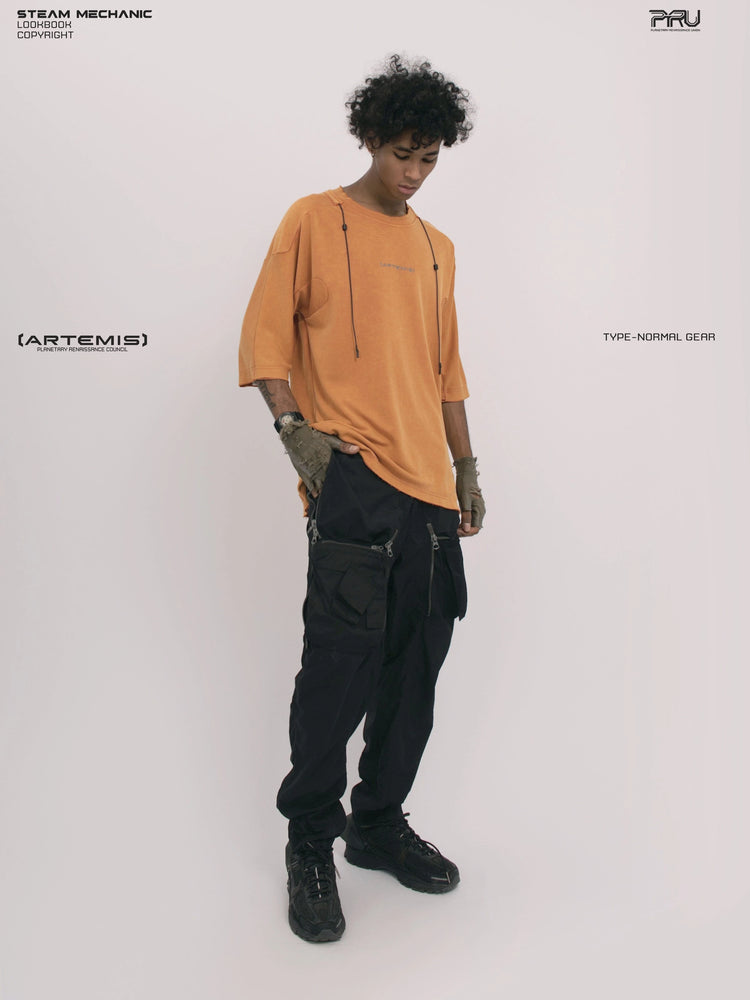 LIGHTSHADOW eclipse orange deconstructed technical tee — full-length front view holding the hem