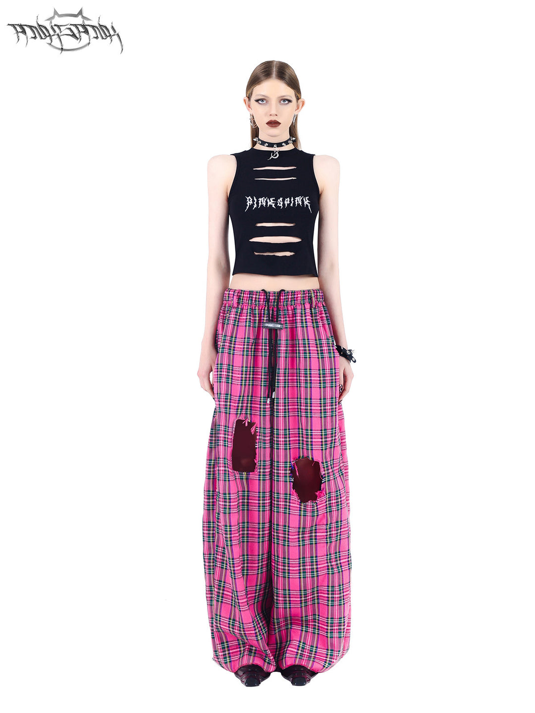 PINKSPINK PINK RIOT distressed plaid wide-leg pants — pink plaid full-length front view of the hero pose