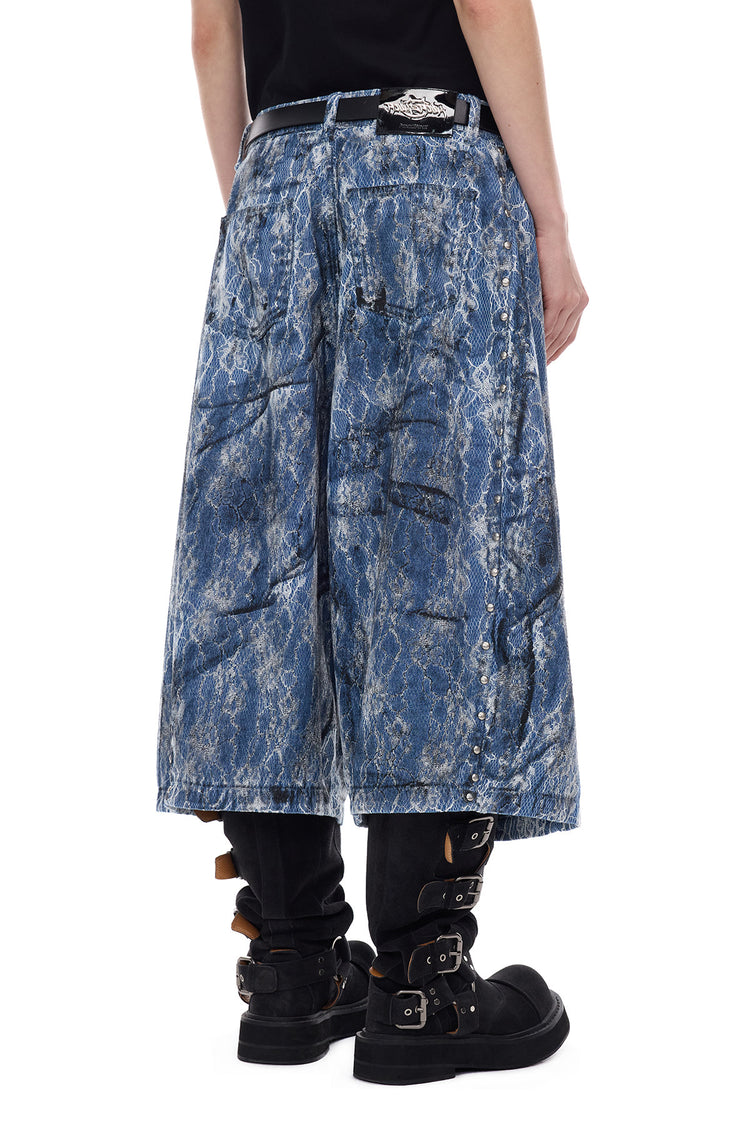 PINKSPINK ELECTRIC MOON lace-coated wide-leg denim shorts in blue — close angled back view of the large pockets and studs