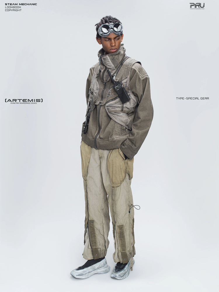 STARCORE mercury brown engineer utility pants — full-length modeled view with goggles and a utility vest