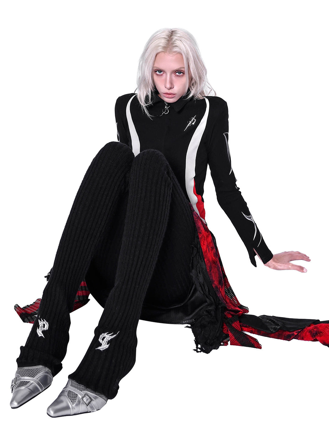 PINKSPINK ELECTRIC MOON layered striped mesh mini skirt — black and red — seated modeled view showing the draped side panels