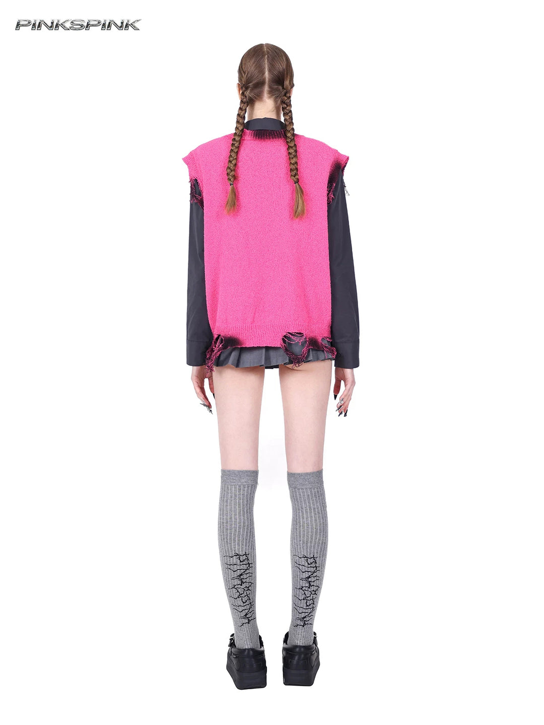 PINKSPINK REBEL distressed ring-detail knit vest in pink — full-length back modeled view layered over a separate dark shirt and mini skirt
