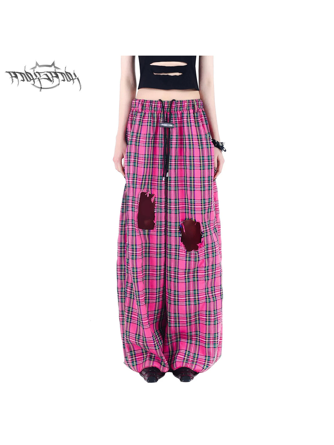 PINKSPINK PINK RIOT distressed plaid wide-leg pants — pink plaid pants, front modeled hero view showing distressed knees