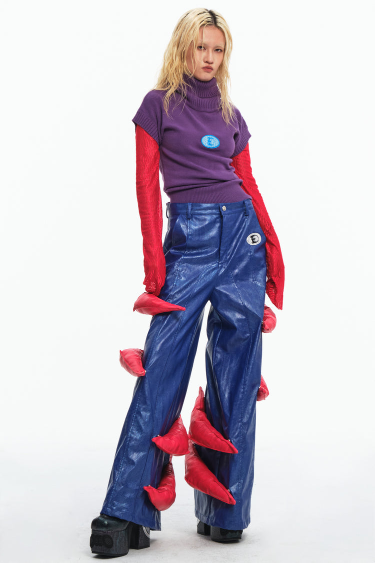 EMBRYO RED CLAW convertible padded PU pants — rear modeled view