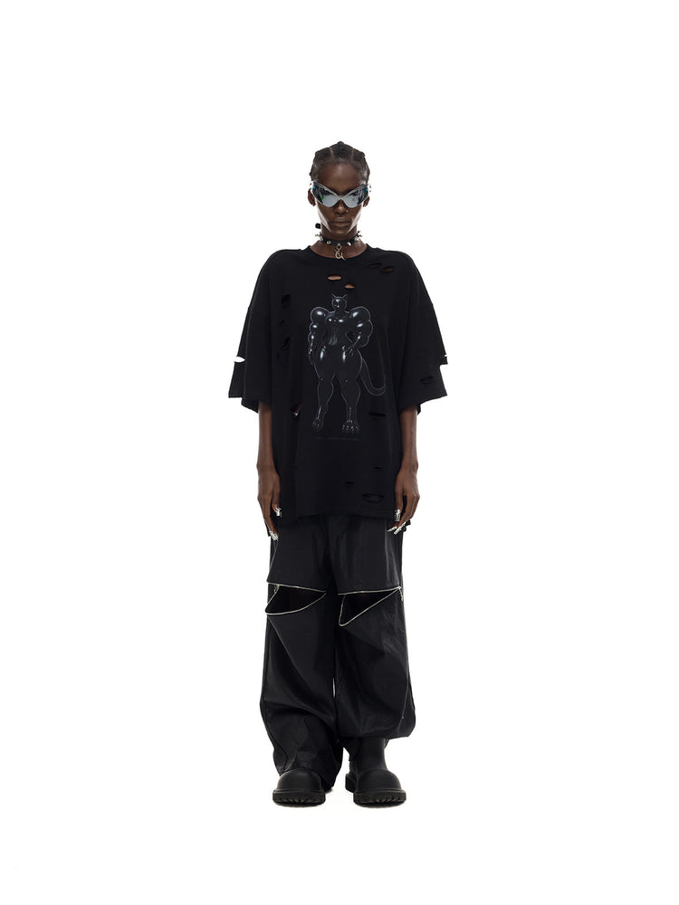 PINKSPINK FUTURE CAT distressed oversized tee in black — front full-length modeled view styled loosely with trousers