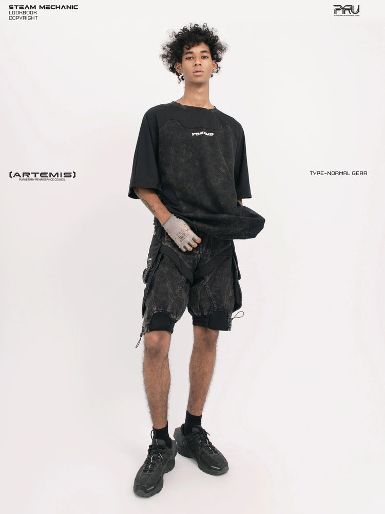 STARCORE black tortoise velcro mesh tee — front modeled view holding the hem