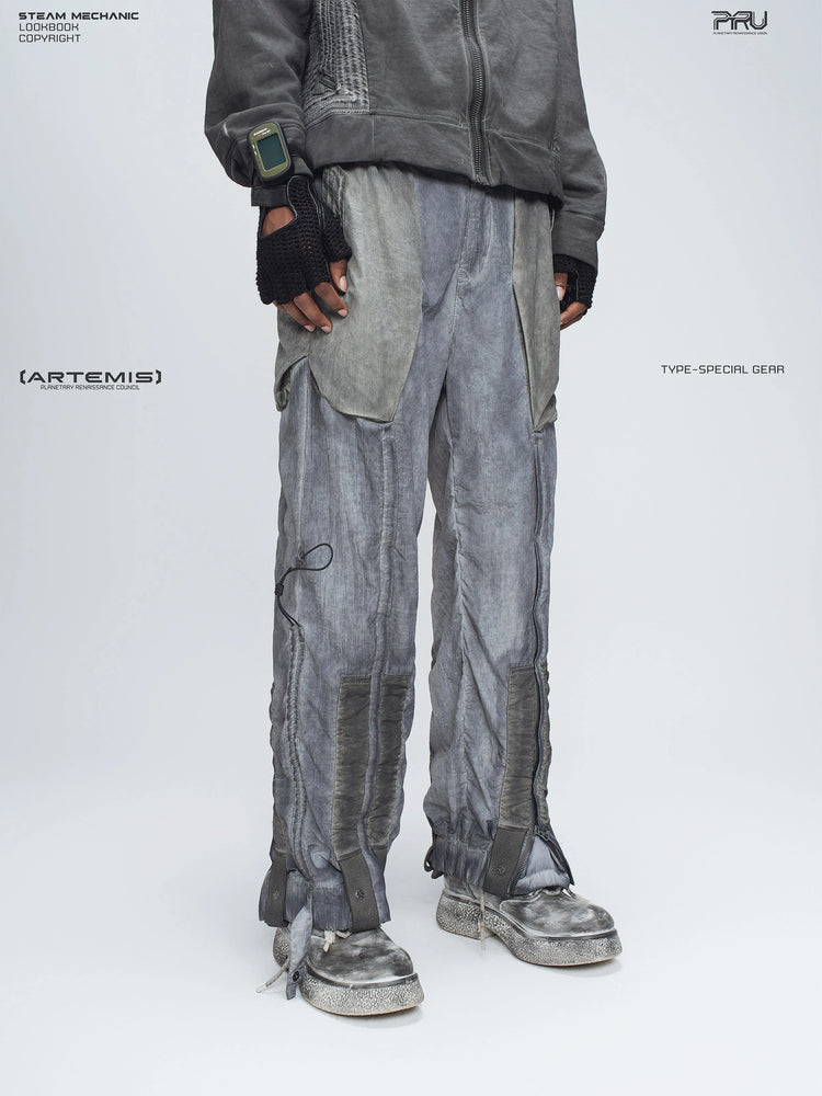 STARCORE moon dust gray engineer utility pants — three-quarter front modeled view facing left