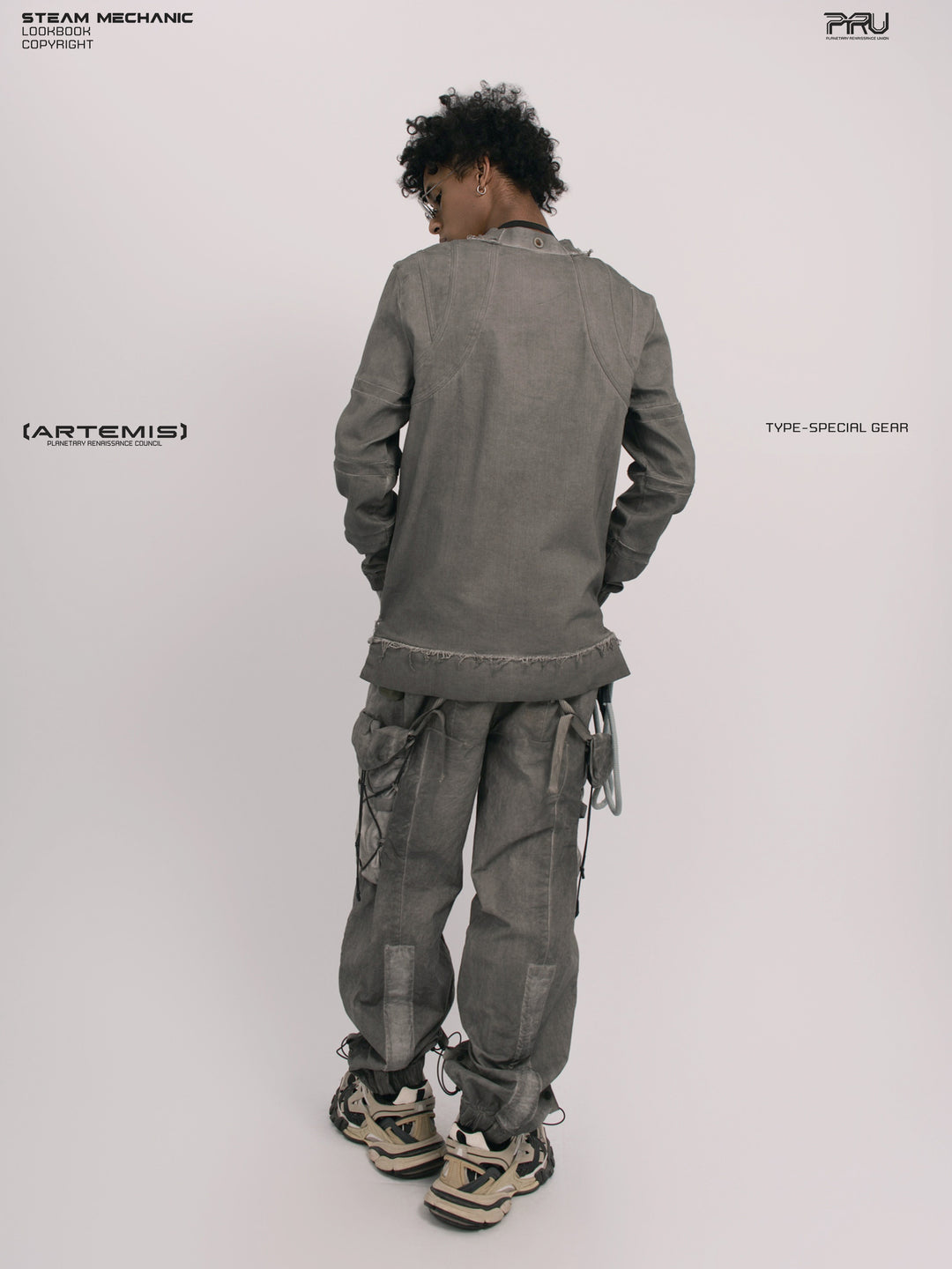 CHAOS ERA moon dust gray raw-edge long-sleeve top — three-quarter rear modeled view