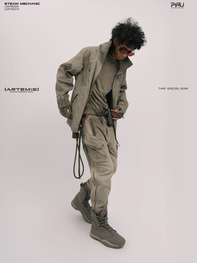 ARTEMIS xirang brown tuck-paneled technical jacket — full-length leaning modeled view with the jacket open