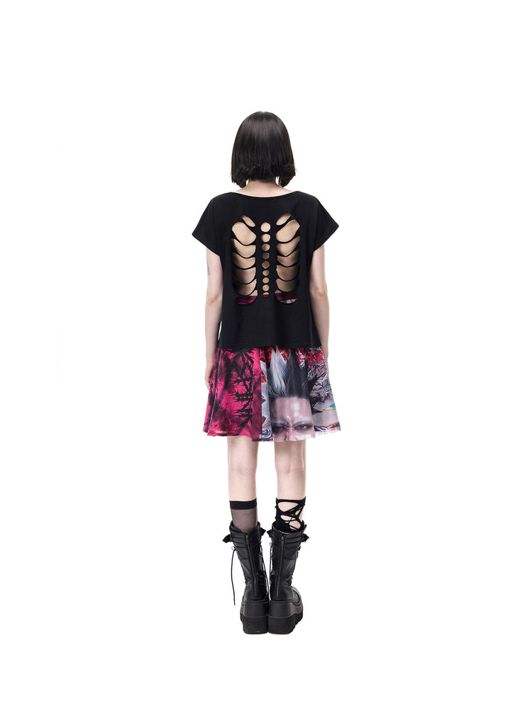 PINKSPINK FUTURE PORTRAIT reversible graphic mini skirt in black and pink — full-length rear modeled view with a separate cutout-back black tee